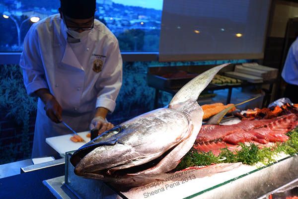 sushi chef making sashimi from a very big tuna at Vikings Marikina